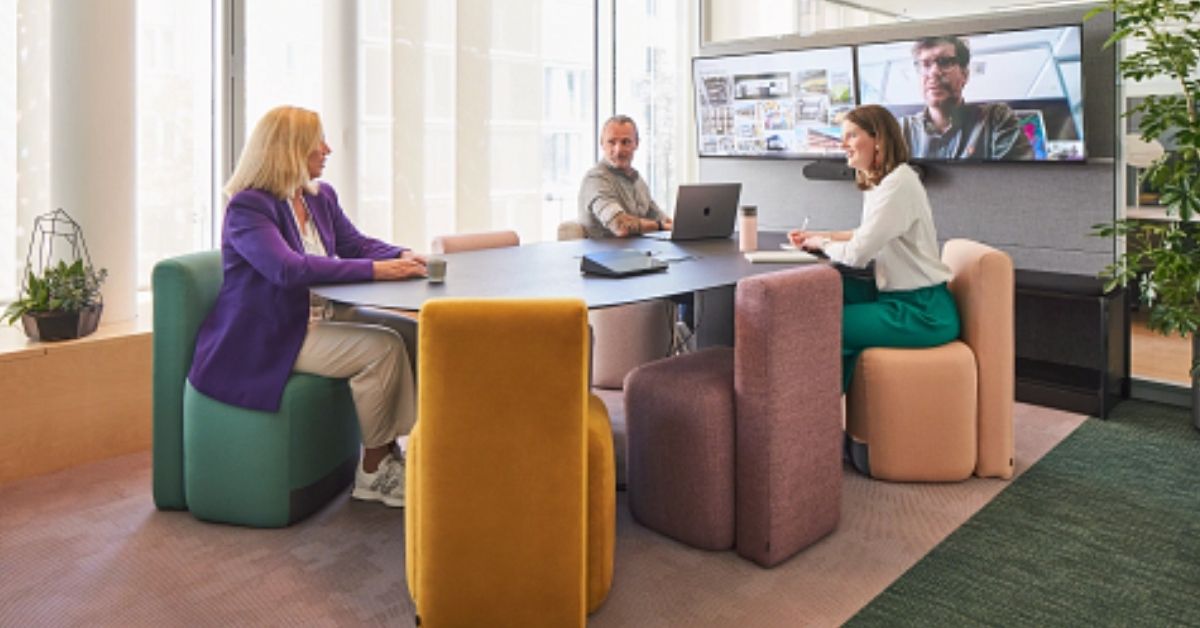 Steelcase hospitality collaboration space with integrated video conferencing and hybrid meeting technology