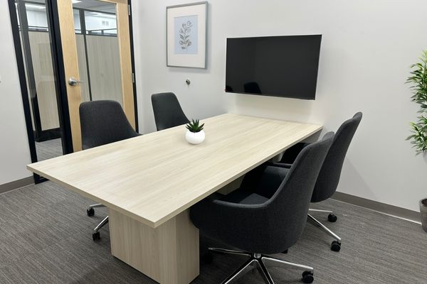 Conference room with AV display and commercial table, Alliance Title & Escrow Nampa Idaho