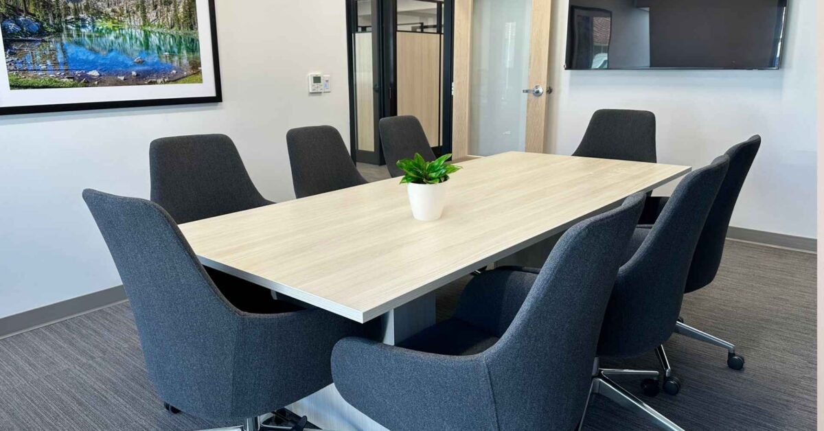 Full conference room with AV display and commercial furniture, Alliance Title & Escrow Nampa