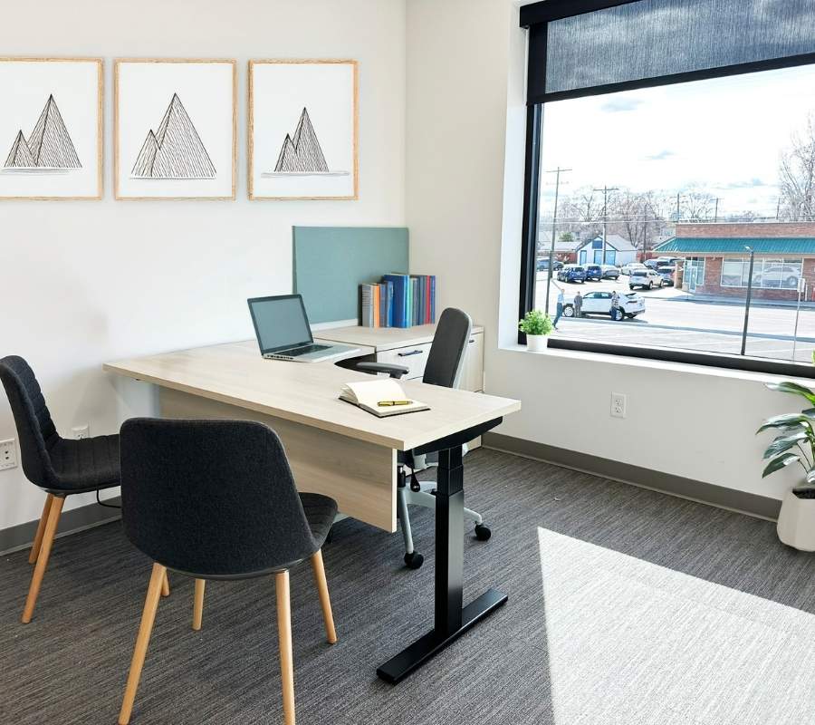 Private office with sit-stand desk and guest seating, Alliance Title & Escrow Nampa Idaho