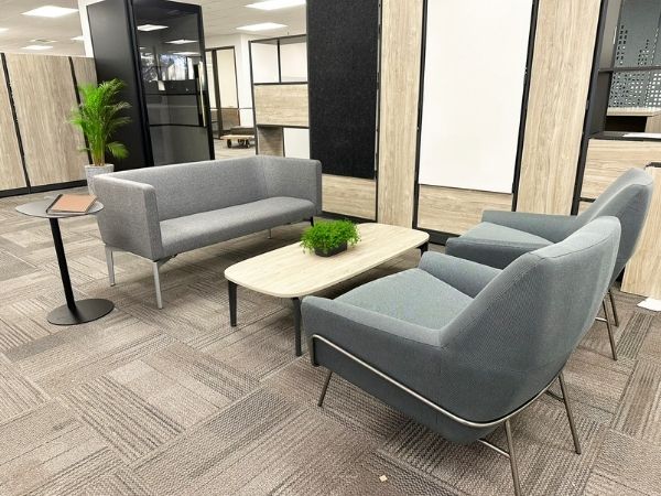 Lounge seating area with soft chairs and side table, Idaho Department of Commerce, Boise, Idaho