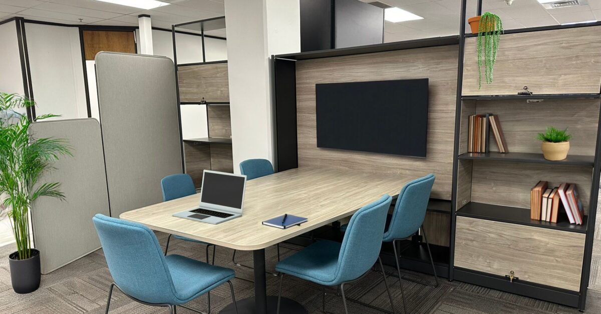 Huddle space with Flex Frame, monitor, and blue guest chairs, Idaho Department of Commerce, Boise, Idaho