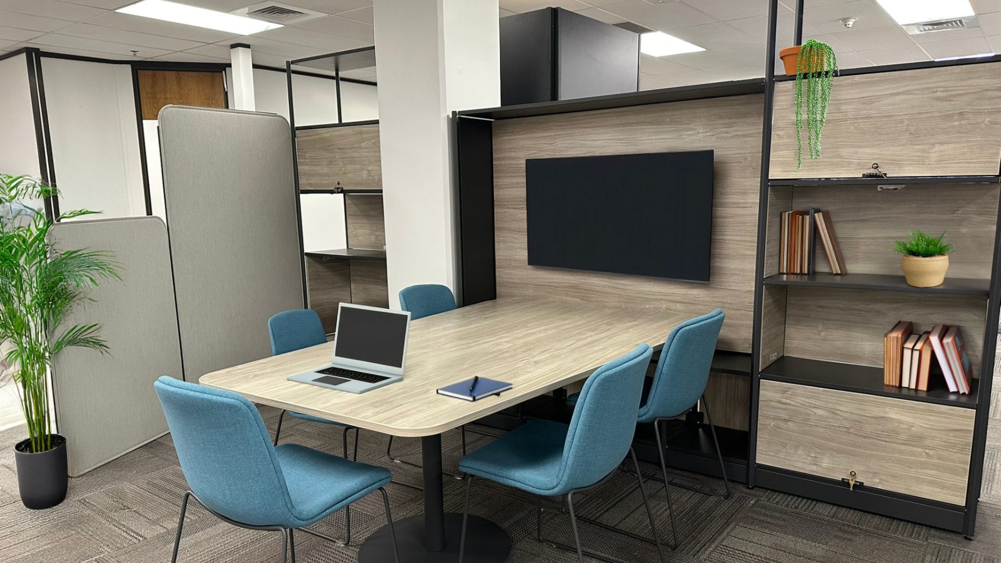 Huddle space with Flex Frame, monitor, and blue guest chairs, Idaho Department of Commerce, Boise, Idaho