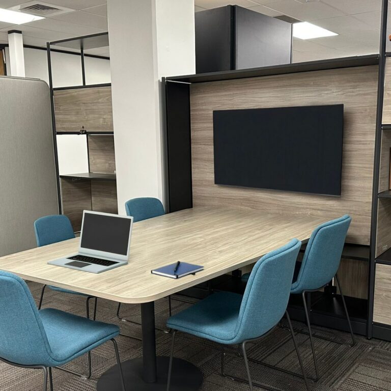 Huddle space with Flex Frame, monitor, and blue guest chairs, Idaho Department of Commerce, Boise, Idaho